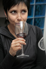 women with glass of red wine