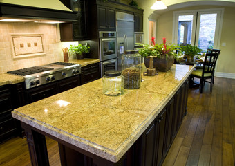 Luxury kitchen with a modern granite island.
