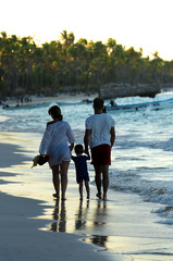 Family walking on a beach