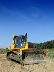 Front loader unloading concrete rubble 