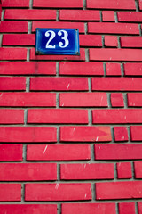 number on brick wall