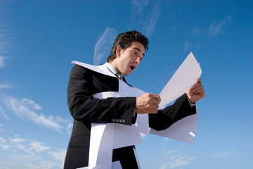 Businessman looking over paperwork