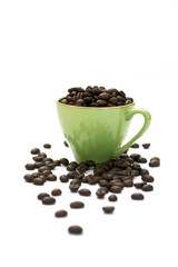 coffee beans in a green cup isolated on white