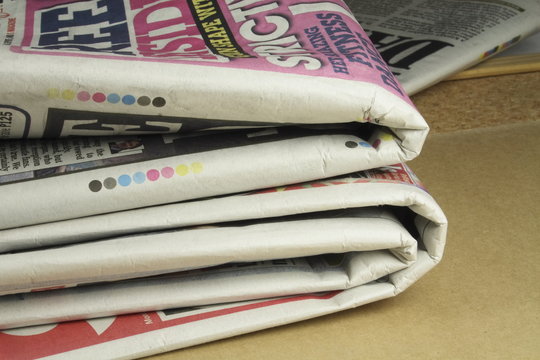 pile of daily newspapers