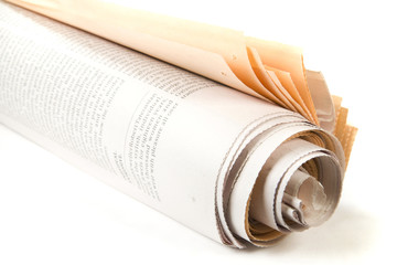 Roll of newspapers on white background