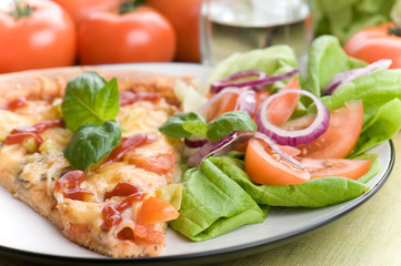 Fototapeta na wymiar Pizza with tomato and basil