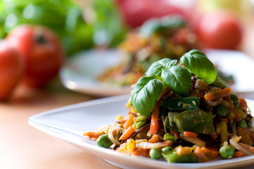 Fresh red vegetable salad with corn and basil