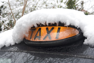 London Black Taxi Covered in snow