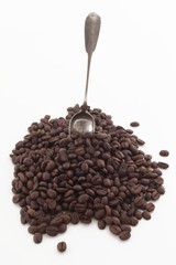 antique spoon in coffee beans