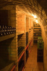 wine cellar with stacked bottles © kubais