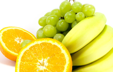 Fototapeta na wymiar grapes, bananas and two halves of orange