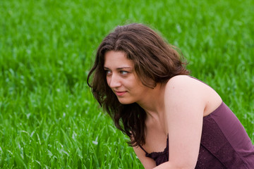 Naklejka na ściany i meble Beautiful lady in a grassfield