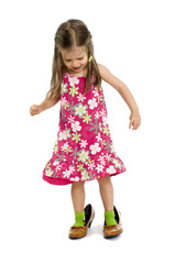 small young girl tries on the mother shoes