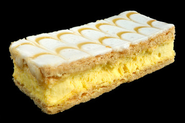 Vanilla custard slice, isolated on a black background