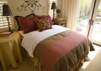 Luxury designer bedroom with large windows.