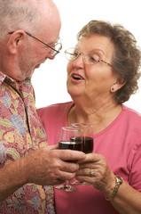 Happy Senior Couple Toasting with Wine