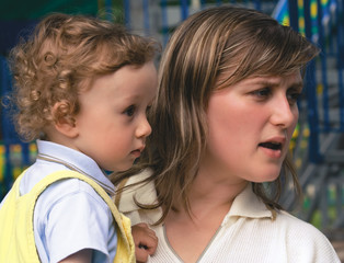 young woman with the small curly boy on hands (2)