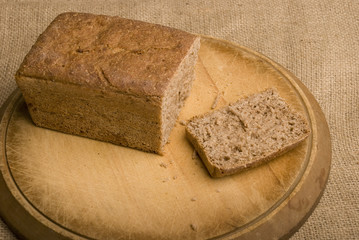 loaf of rye bread with one slice removed