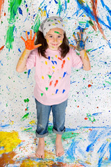 Obraz na płótnie Canvas Girl playing with painting