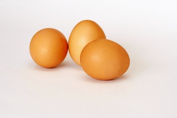 Three eggs on white background