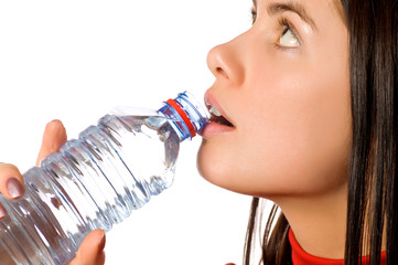 young beautiful girl with mineral water (isolated on white)