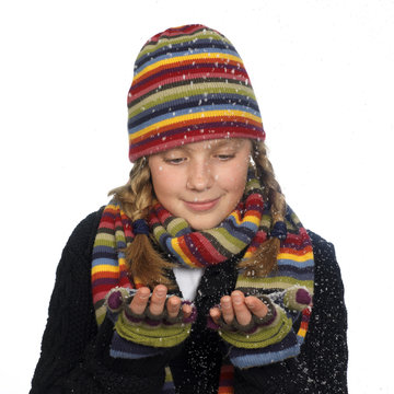 Happy Girl Catching Snow Flakes In Her Hand