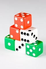 Six dice pieces in various colors