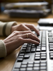 Businessman typing on a computer keyboard
