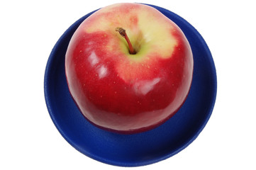 juicy apple on a blue dish