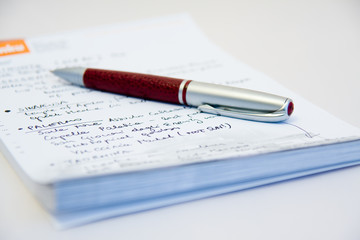 a close-up of notebook and a pen on it