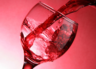 Close-up of pouring red wine