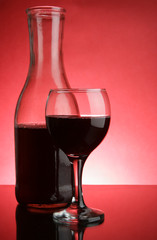 Glass and jug of red wine