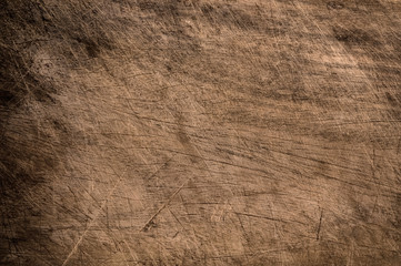 Old scratched wooden table.
