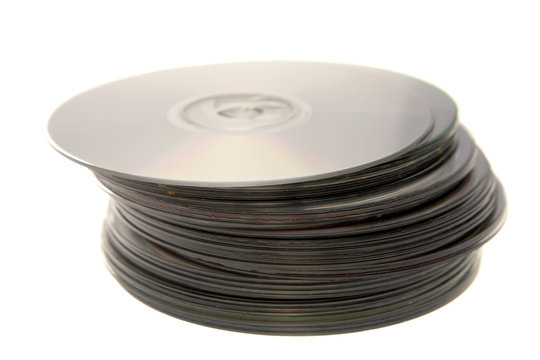 Stack of compact discs on white