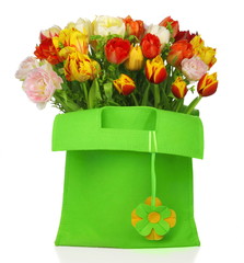 green bag with beautiful tulip bouquet and with flower deco