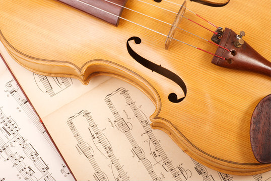 Old viola and vintage music sheet