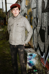 portrait of hooligan on graffiti wall