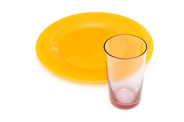 Yellow plate and glass isolated on the white