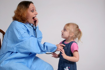 Nurse playing with a young patient