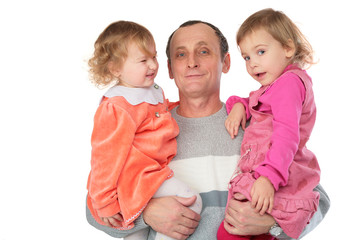 grandfather hold two granddaughters on hands