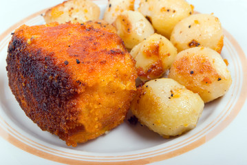 Roasted potatoes   and fish ,Close-up