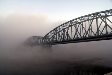 Bridge disappearing in fog