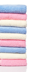 Obraz na płótnie Canvas Multicolored towels stacked