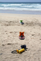 kitesurf boards and pump on beach