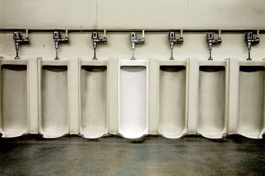 Dirty Men's Bathroom With One Clean Urinal