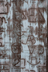 Cowboy Branding Iron Brands Burned into an Old Barn Door