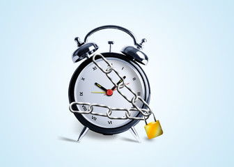 Alarm clock tied in chains and locked
