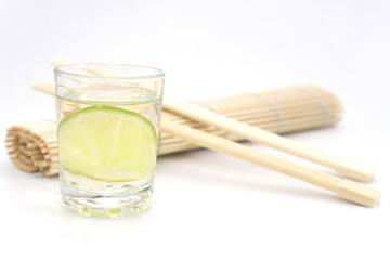Tequila with lime and chopsticks