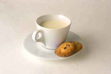 Cup of coffee with milk and cookies, clipping path included