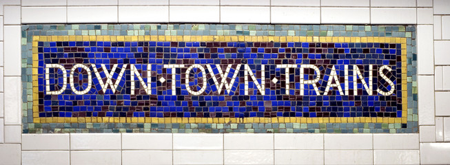 Downtown trains sign in New York subway station